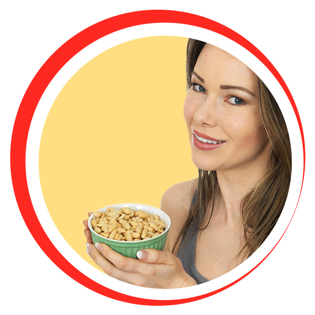 Woman holding a bowl of peanuts.