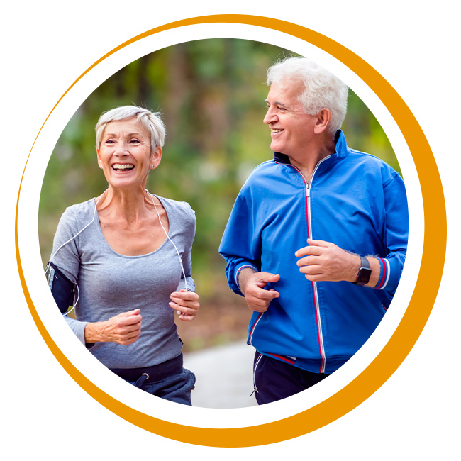 Healthy elderly couple jogging together.